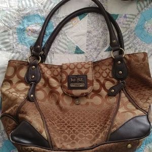 Gently used Coach bag. Some wear on the handles